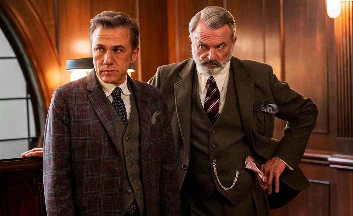 Christoph Waltz & Sam Neill Are Evil CEOs Disrupting The World Of Magic Through Corporate Strategies